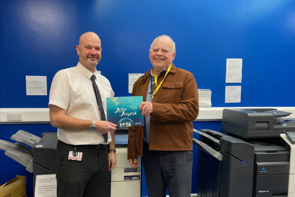 Peter Tilbury from Burbage Junior School receiving a copy of Jessie the Jellyfish from John Sharp.